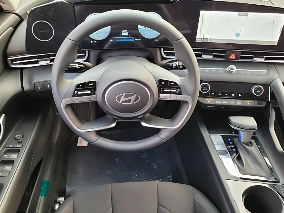 Close-up of Hyundai’s digital dashboard and steering wheel inside a modern vehicle